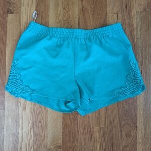 Vibrant Blue Athletic Shorts with Elastic Waistband and Floral Hem